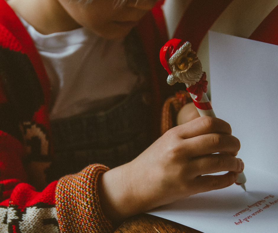 The sky at sunset with green foliage at the front focal point of the image.