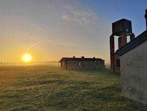 An image of Stow Maries Great War Aerodrome at dawn.