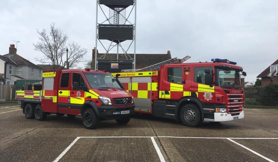 Two fire engines parked outside.