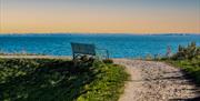 Bench on the seawall at Goldhanger, Paula Freeman