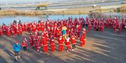 Runners lined up at Promenade Park for Santa Fun Run