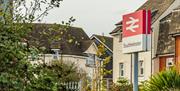 Station sign by old houses at Southminster